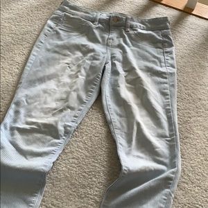 Cropped pin stripes faded jeans